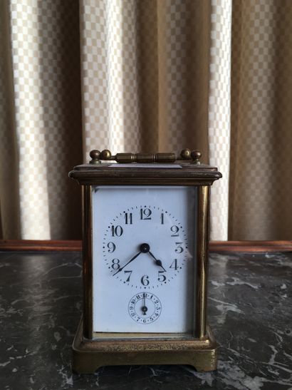 null 
Lot: Travelling clock, gilt metal, circa 1900 (Ht 12 cm. Wear to the gilding...