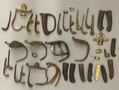 Lot of elements of guards of various swords....
