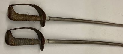 null Two sabers, single-branch burnished iron guards, stingray covered fuses; slightly...