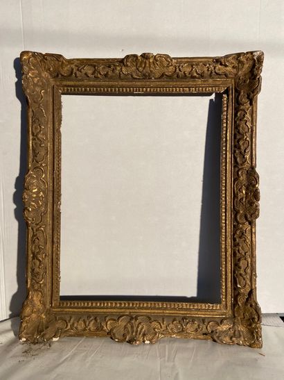 Carved and gilded wood frame with Bérain...