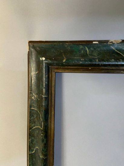 null *Molded wooden frame with reversed profile and faux green marble

Italy, Siena,...
