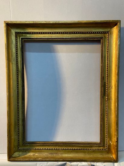 Wood and gilded paste frame decorated with...