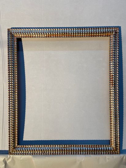 Wood and silver plated frame with wavy decoration...