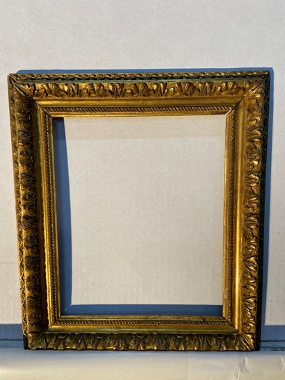 Carved and gilded wood frame with fine decoration...