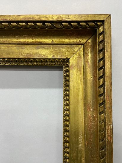 null Carved and gilded oak frame decorated with rais -de-c urs and ribbons, stamped...