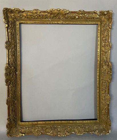 *Carved and gilded oak frame with Bérain...