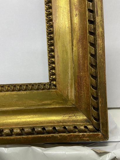 null Carved and gilded oak frame decorated with rais -de-c urs and ribbons, stamped...