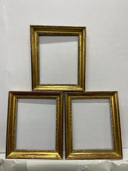 Set of three molded and gilded wood and paste...
