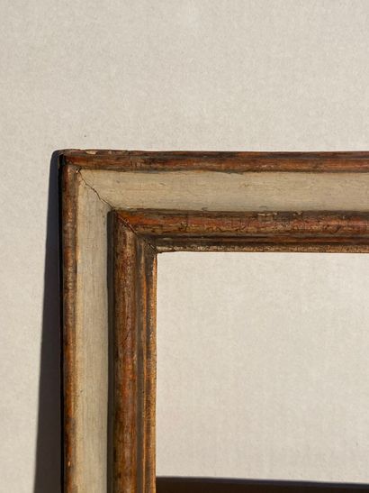 null Moulded limewood frame with grey and old silver plated inverted profile

Italy,...