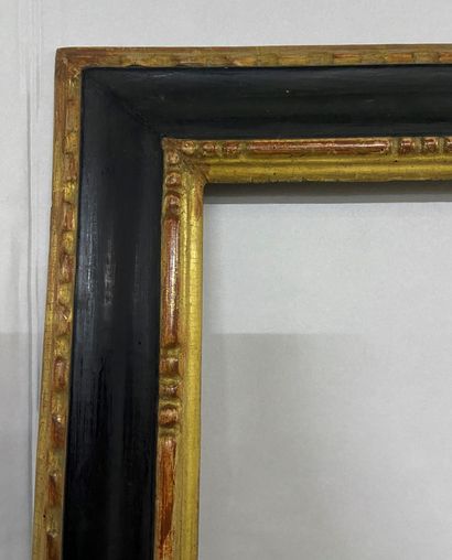 null Walnut frame with gilded and blackened mouldings and reversed profile 

Italy,...