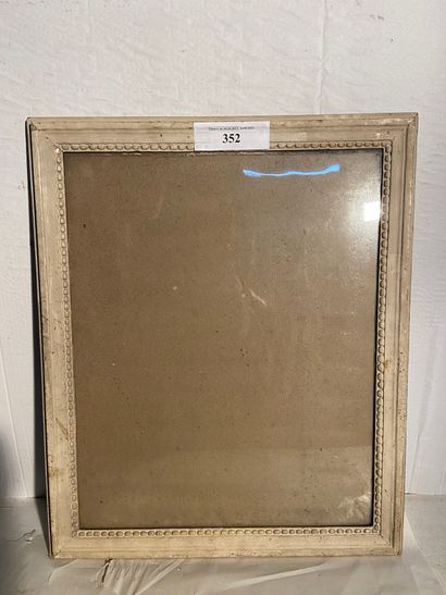White lacquered wood frame decorated with...