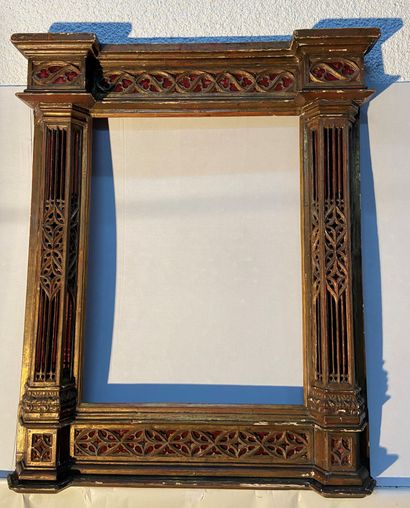 Carved wood frame with architectural and...