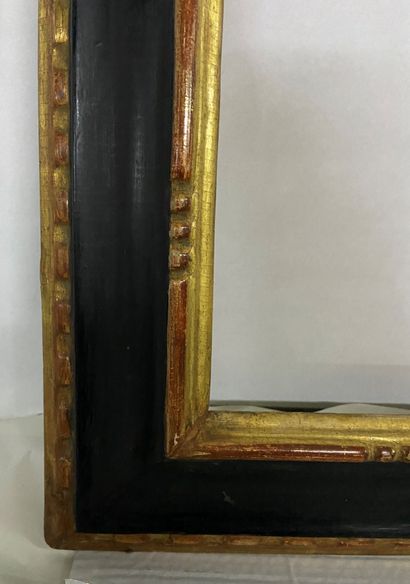 null Walnut frame with gilded and blackened mouldings and reversed profile 

Italy,...