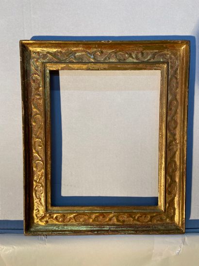 null Moulded and gilded wood frame called "a cassetta" with scrolls decoration with...