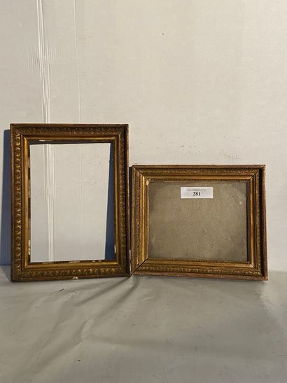 null Two frames in wood and gilded paste with palmettes decoration, one with its...