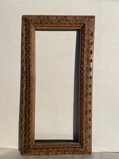 Frame in natural walnut carved in reverse...