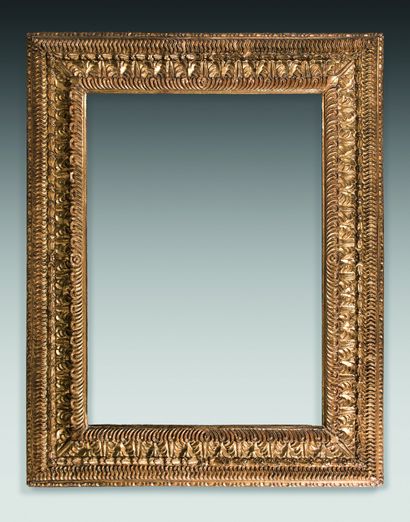 Carved and gilded limewood frame with inverted...