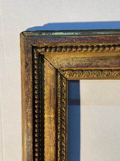 null Carved and gilded oak frame with a beautiful decoration of rais-de-c urs and...