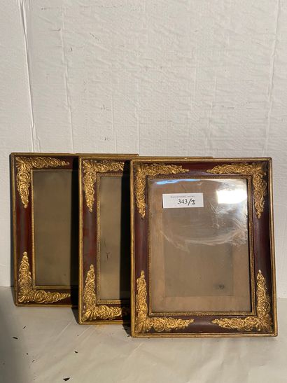 Set of three gilded wood and paste frames...