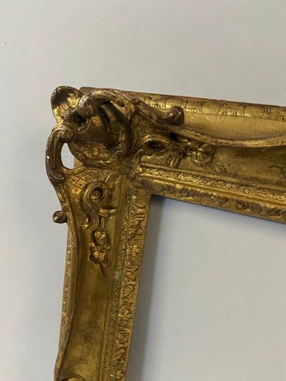 null Carved and gilded oak frame with openwork decoration of shells and pig tails,...