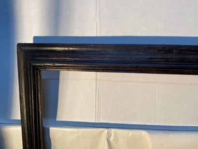 Large moulded and blackened wood frame with...