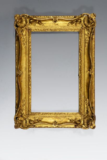 null Carved and gilded oak frame with openwork decoration of shells and pig tails,...