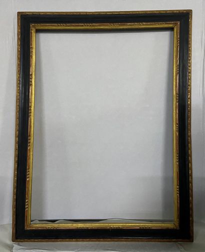Walnut frame with gilded and blackened mouldings...
