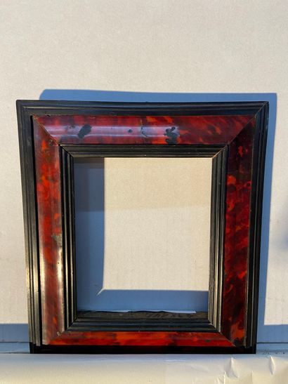 Wooden frame with red tortoiseshell veneer...