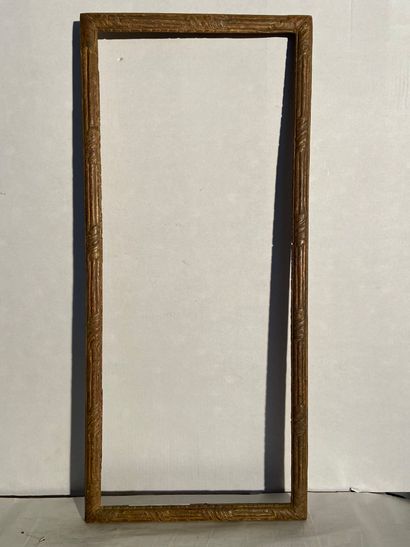 Carved and gilded wood stick with foliage...