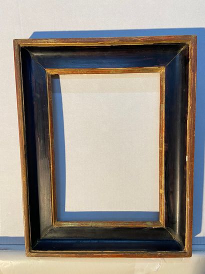 Frame in gilded and blackened molded wood...
