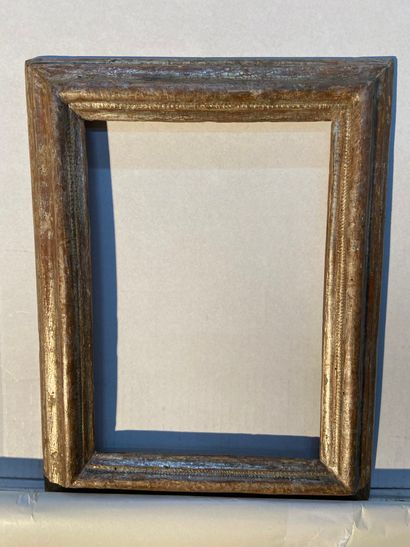 Molded and silvered wood frame with reversed...