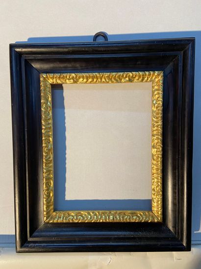 Frame in blackened and gilded wood called...