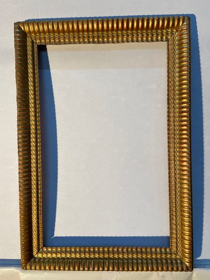 Wood and gilded paste frame with wavy decoration

Napoleon...