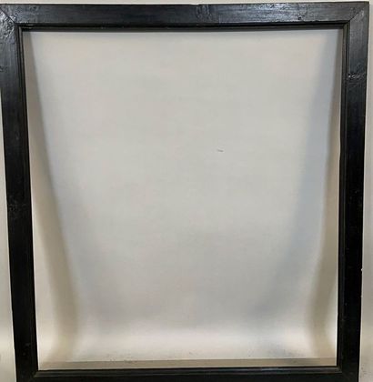 Large frame in molded and blackened pine...