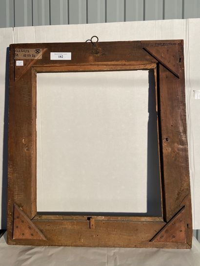 null Carved and gilded limewood frame with reversed profile

decorated with a frieze...