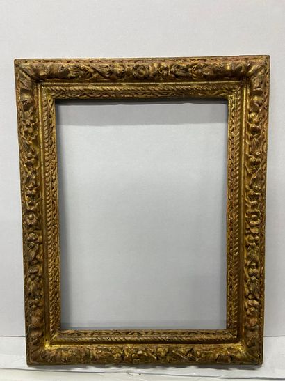 Carved and gilded wood frame decorated with...