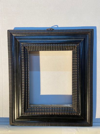 Frame in blackened wood and guilloche rods

Venice,...