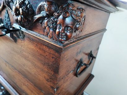 null Walnut chest with carved floral decoration. Partly from the XVIIth century....
