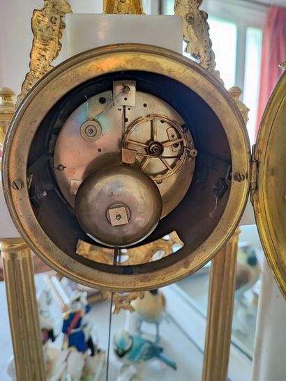 null 
Portico clock in white marble and ormolu ornamentation, surmounted by flowered...