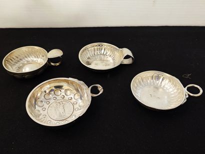 null Set of four silver wine tastes. France, XIXth and XXth century Decorated with...