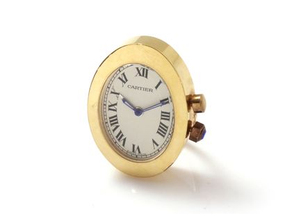 null CARTIER ''BAIGNOIRE''. Travel alarm clock in gilded metal, oval shape, ivory...