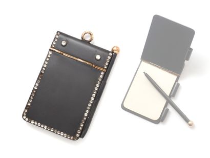 null Charming blackened steel and gilded metal notebook decorated with rhinestones....