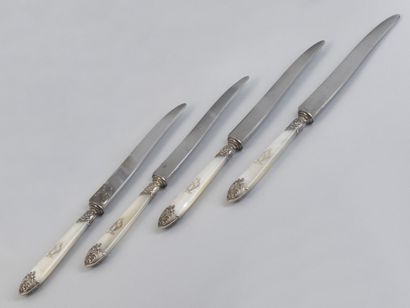 null Eighteen silver and mother-of-pearl table knives Apparently without hallmark,...