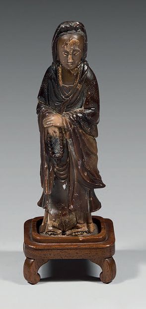 CHINE Steatite statuette of Guanyin standing with both hands joined against her belly,...