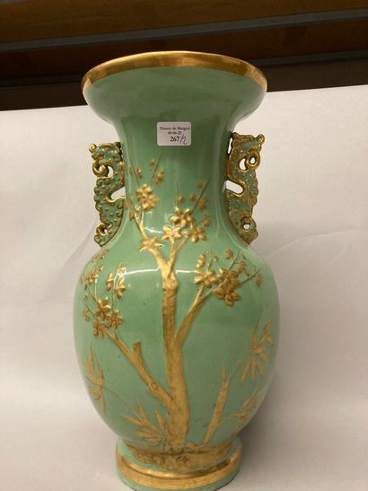 PARIS Octagonal porcelain Medici vase, the pedestal resting on a square foot, decorated...