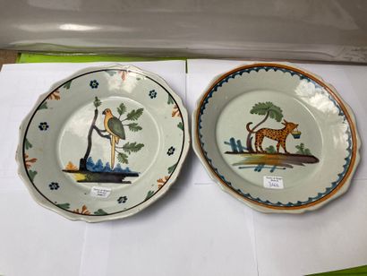 NEVERS Two earthenware plates decorated in polychrome for one of them of a spotted...