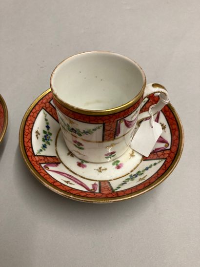 PARIS Pair of porcelain litron cups and their under cup decorated in polychromy and...