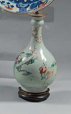 CHINE * A long narrow-necked porcelain vase decorated in famille rose enamels with...