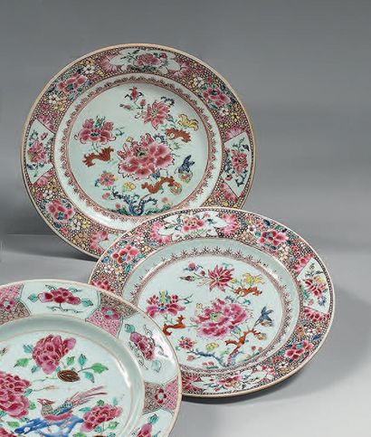 CHINE Two circular porcelain plates decorated in famille rose enamels with branches...