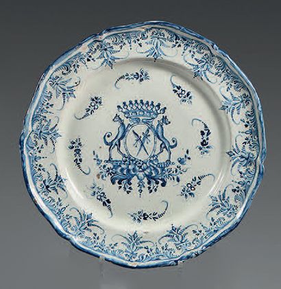 EST DE LA FRANCE Earthenware dish with a contoured border, decorated in blue monochrome...